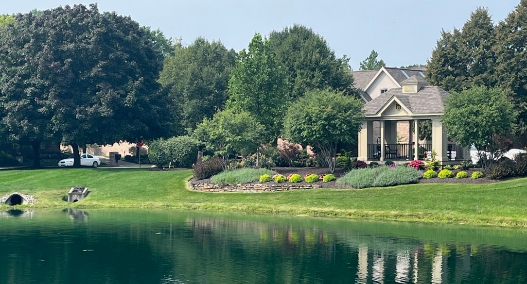 Lakeside home with manicured gardens commercial lawn care